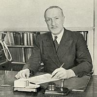 President Irving Mauer sitting in Middle College for the 1938 Promotional Booklet.
